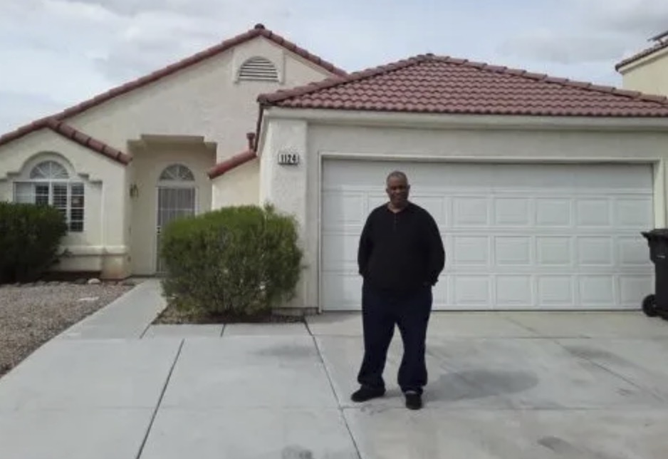 picture of Clyde F. in front of a house